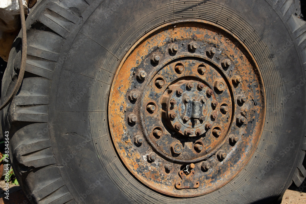 a big truck wheel with lots of fasteners