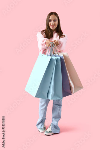 Young woman in hoodie with ...