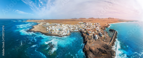 Panoramic aerial view of the famous El Cotillo beach, in Fuerteventura island: View of the secluded beaches on the coast of the Atlantic Ocean, a paradise for surfing  tourists, in the Canary Islands. photo