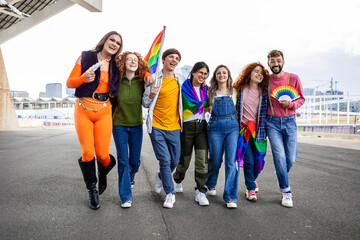Happy diverse group of friends celebrating hay pride festival day month outdoors. LGBTQI community concept.