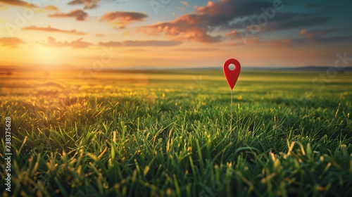 A green field basks in the glow of sunset, with a prominent big red pin marking the destination. This imagery embodies the concepts of goal-setting, dreams, reaching the end, enjoying picnics, and ach photo