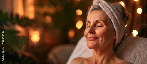 Mature woman enjoys spa with stone massage and skincare at beauty salon for healing back muscles and holistic therapy.
