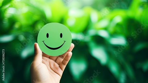 Hand holding green paper cut happy smile face on green background , positive thinking, mental health assessment , world mental health day concept - generative ai