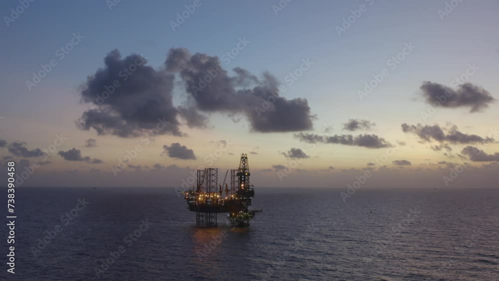 Aerial view of silhouette offshore jack up drilling rig during sunset - oil and gas industry
Aerial view of silhouette offshore jack up drilling rig during sunset - oil and gas industry