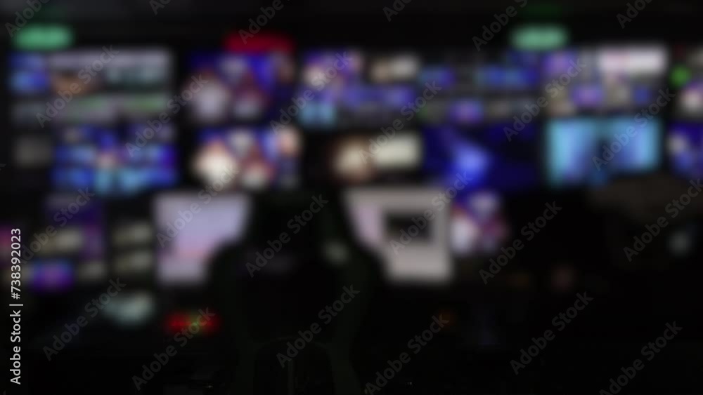 A blurry News TV studio station, live view screens with workers watching all the monitors changing their pictures. Slow motion, Hi Quality 4K footage A blurry News TV studio station, live view screens with workers watching all the monitors changing their pictures. Slow motion, Hi Quality 4K footage