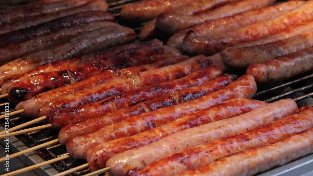 Group of sausages on a grill over hot coals. Group of sausages on a grill over hot coals.