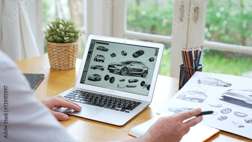 Car design engineer analyze car prototype for automobile business at home office. Automotive engineering designer carefully analyze, finding flaws and improvement for car design with laptop Synchronos