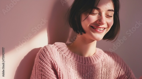 Love yourself concept Photo of lovely smiling woman embraces herself has high self esteem closes eyes from enjoyment likes her new comfortable soft pink sweater tilts head stands indoo : Generative AI