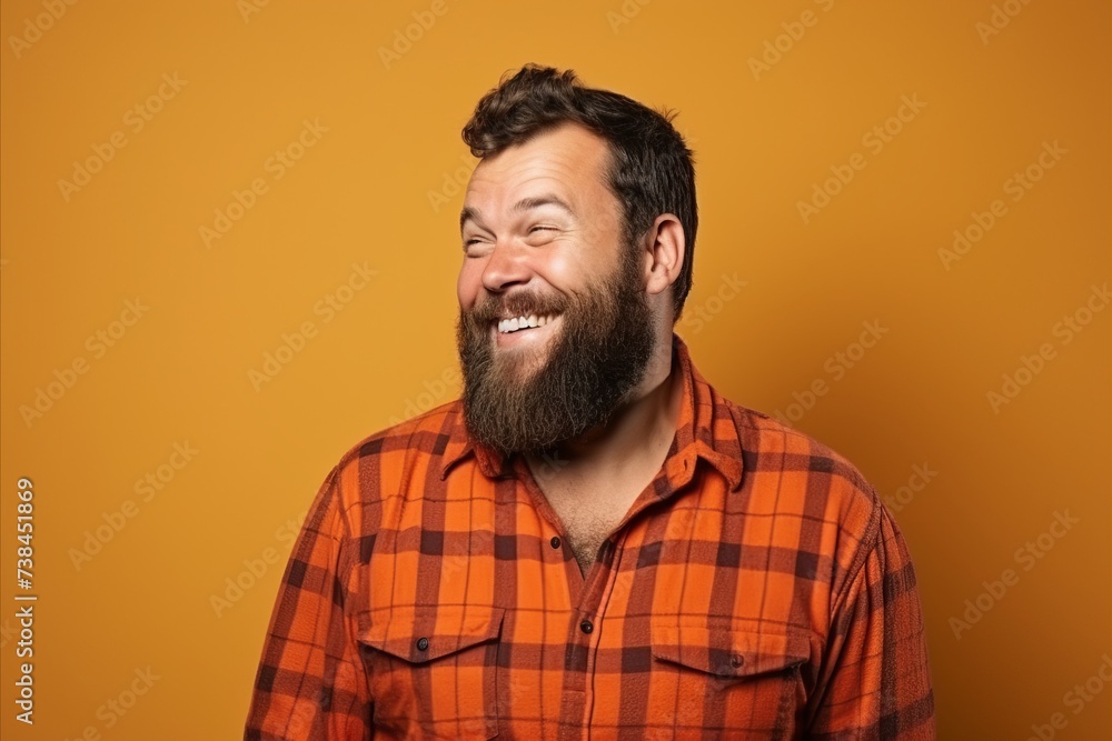 Portrait of a funny hipster man laughing over yellow background. Portrait of a funny hipster man laughing over yellow background.