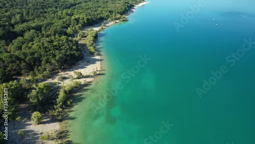 The paradisiacal colors of Lake Sainte-Croix and its green forests in Europe, France, Provence Alpes Cote dAzur, in the Var, in summer, on a sunny day. photo