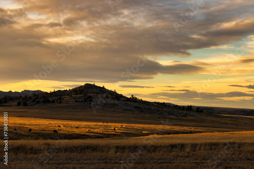 Mountain hill silhouette and sunnset photo