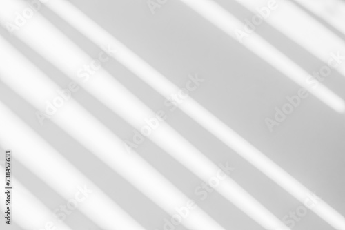 Gray shadow and light blur abstract background on white wall from window. Dark stripe grey shadows indoor in room background, monochrome, shadow overlay effect for backdrop and mockup design
