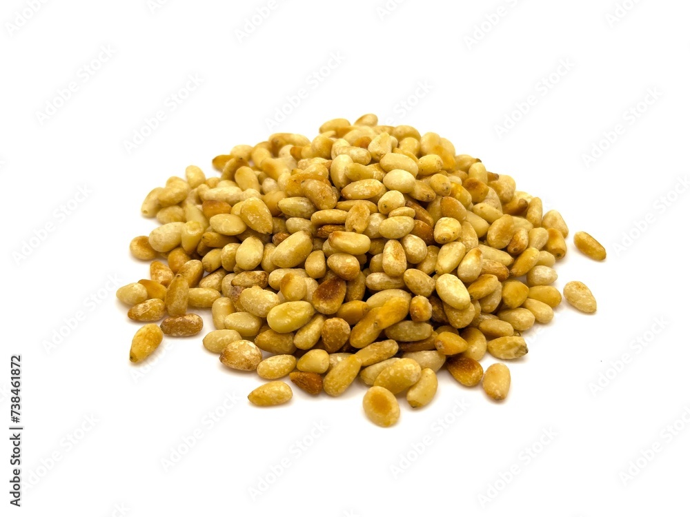 Closeup of Lightly Toasted Pine Nuts, Isolated on a White Background Closeup of Lightly Toasted Pine Nuts, Isolated on a White Background