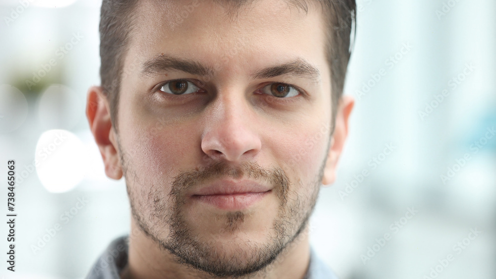 Fototapeta premium A man's face looks at the camera in close-up