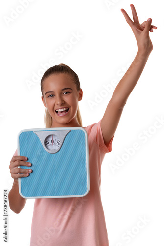 Teenager girl isolated on white background holding the weighing scale and showing victory sign