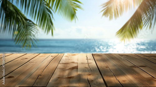 Top of wooden table with sea view and palm leaves Blur of calm sea and sky at tropical beach background for product display montage.