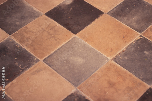 Antique floor tiles in gray and beige tones