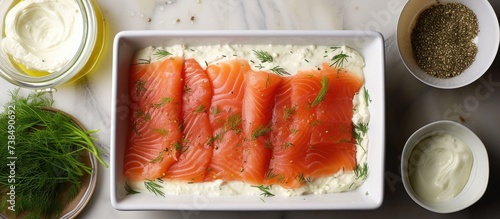 Creating a layered spread with smoked salmon, cream cheese, dill, and horseradish in a step-by-step format.