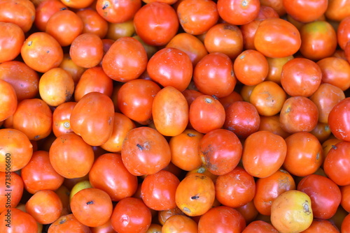 Delicious red tomatoes. Summer farm market trays farm full of organic vegetables It can be used as a background. (Selective focus)