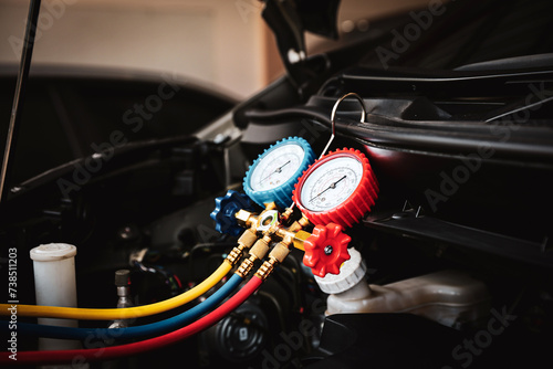 Air refrigerant meter manifold gauge to check car air conditioner system heat problem and fix repairing and filling air refrigerant.