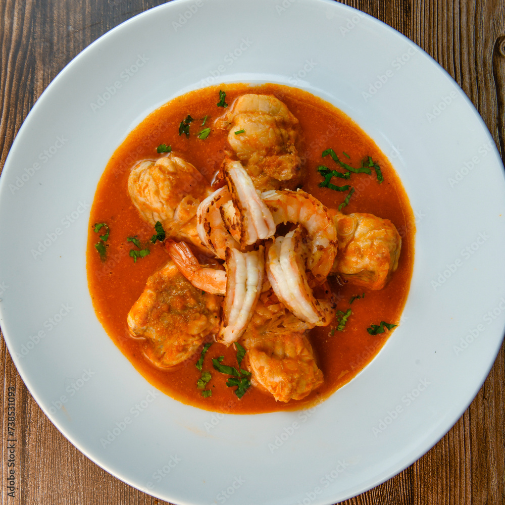 Recipe for Armorican-style monkfish tail, prawns, flambees with cognac, High quality photo Recipe for Armorican-style monkfish tail, prawns, flambees with cognac, High quality photo