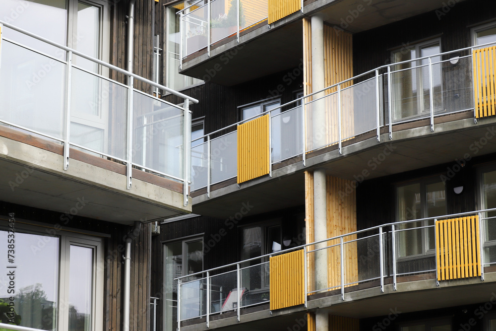 Close-up view of a modern apartment building with balconies.