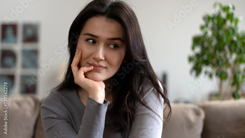 woman sitting on sofa at home