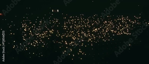 People waving flashlight of their phones in a crowded concert