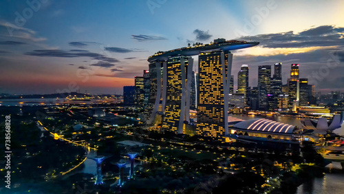 Singapore and Marina Bay skyscrapers. Aerial view at night from drone