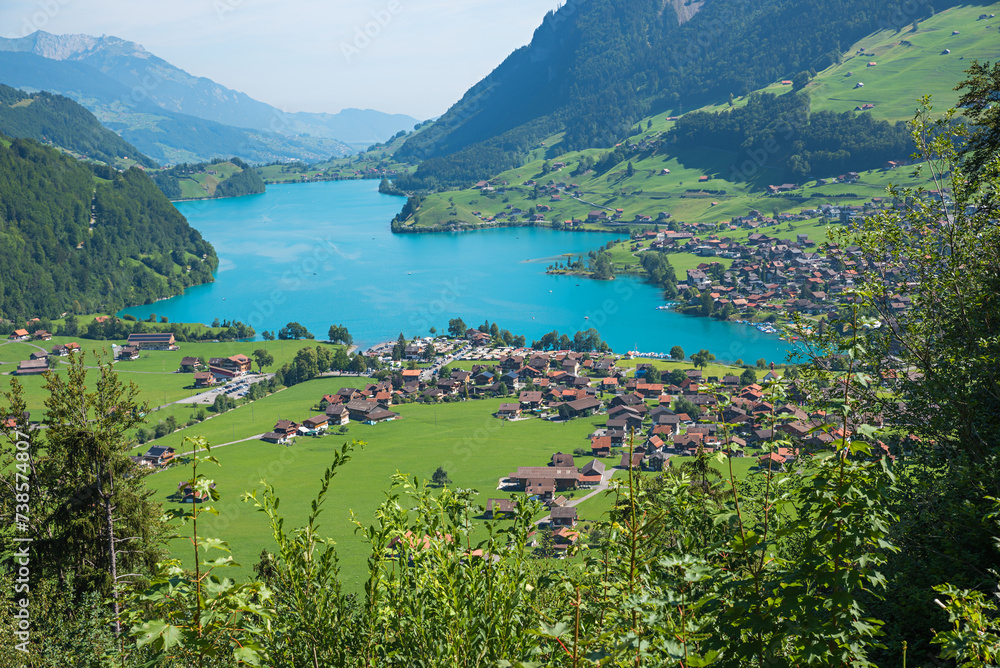 tourist resort Lungern and lake Lungernsee, view from Brunig pass road ...