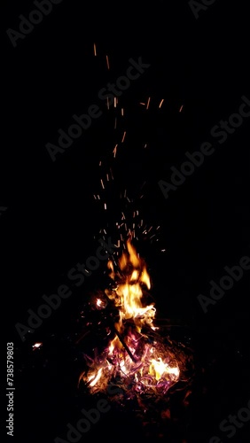 Top view of bonfire at night, vertical slow-motion video