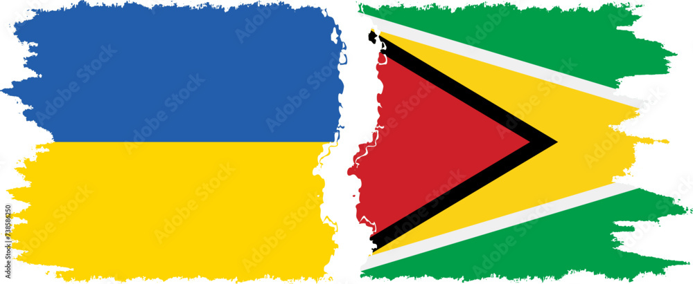 Obraz premium Guyana and Ukraine grunge flags connection vector