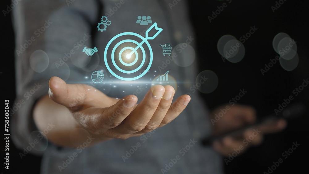 Fototapeta premium Businessman touching virtual dartboard with arrow ,Business Achievement objective target concept.