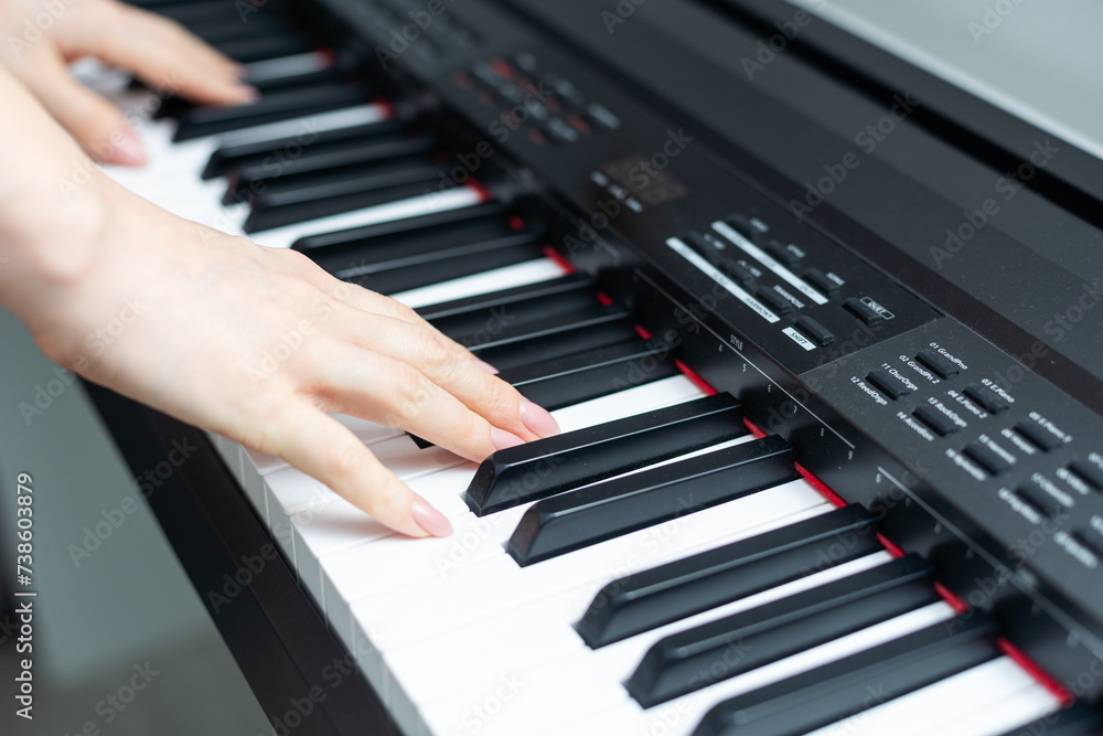 keyboard and hands playing the piano keyboard and hands playing the piano