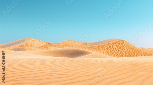 Desert landscape with sand dunes and clear blue sky