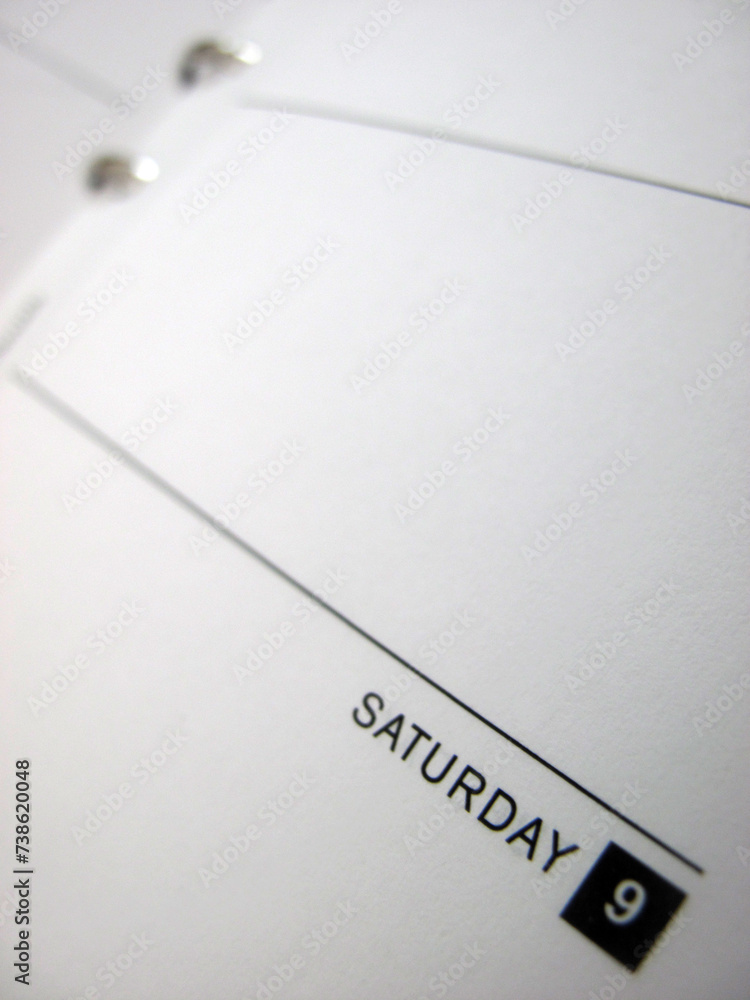 Empty diary page with binder - shallow depth of field - focus is on the date Saturday 9 Empty diary page with binder - shallow depth of field - focus is on the date Saturday 9