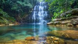 waterfall cascading into a crystal-clear pool, surrounded by verdant foliage, nature landscape