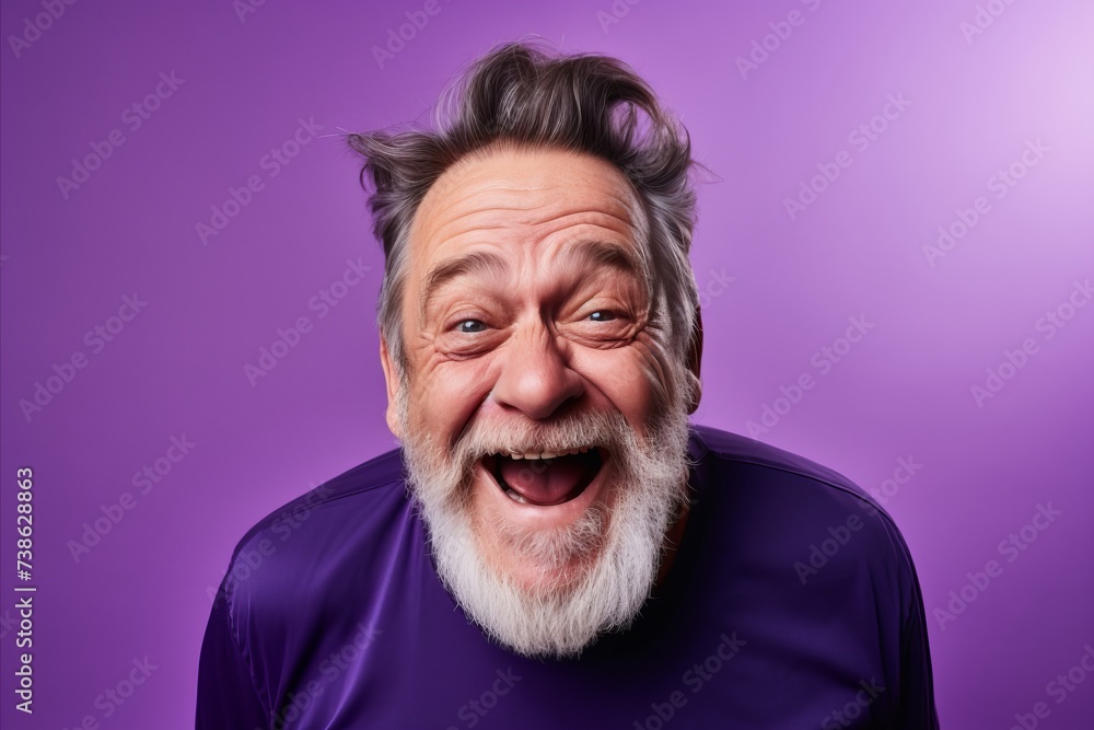 Surprised senior man with long white beard and mustache on purple background