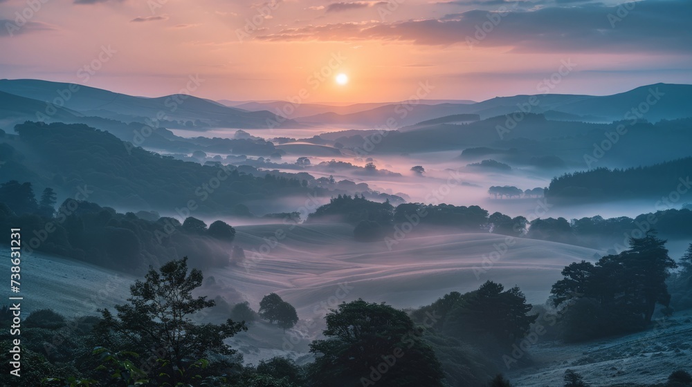 Sunrise over a misty valley, with layers of hills visible in the distance, nature landscape