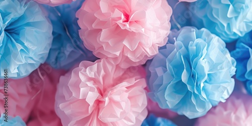 Colorful tissue pom poms in pink and blue. Perfect for adding a fun and festive touch to any celebration or event photo