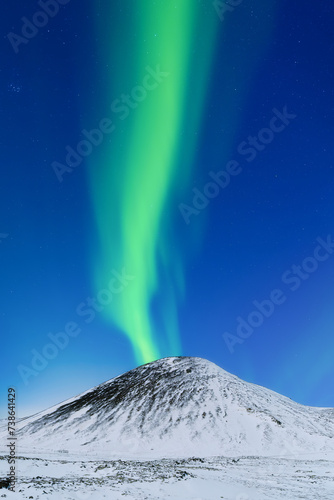Aurora borealis on the Lofoten islands, Norway. Northern Lights over the mountains. Scandinavia. Night sky with polar lights. Landscape in the north in winter time. © biletskiyevgeniy.com