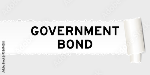 Ripped gray paper background that have word government bond under torn part