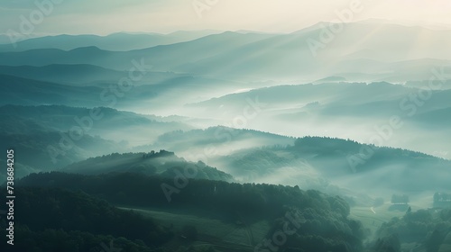 Beautiful aerial View of hilly landscape in morning mist with sun rays, banner format 