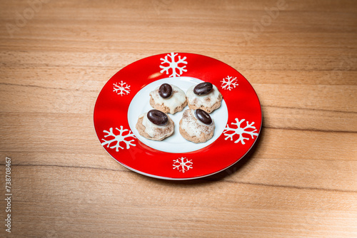 Various homemade cookies from the Christmas bakery on a small plate.