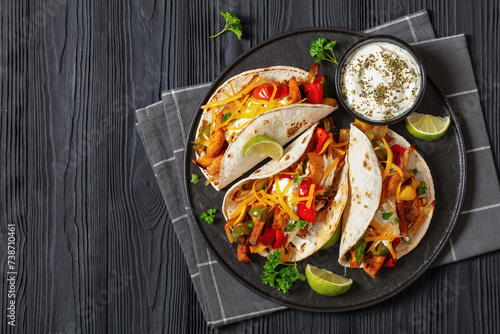 baked tex-mex chicken fajitas on a plate, top view