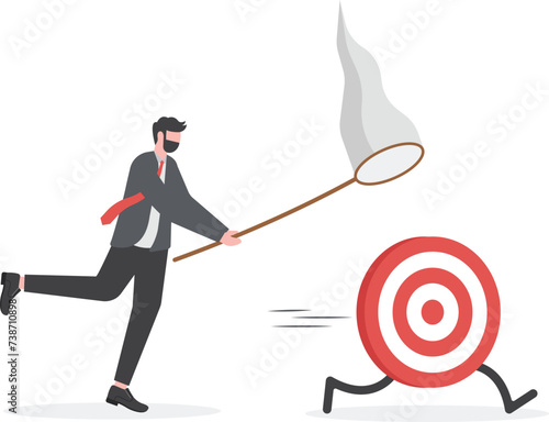 Concept of success. Business man try to catch the goal.

