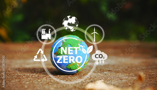 Fototapeta Naklejka Na Ścianę i Meble -  Explore a small world globe symbolizing CO2 reduction and net zero emissions by 2050. Embrace the icon of sustainability and join the journey towards a greener future.
