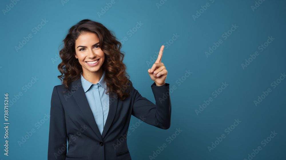 Smiling business woman pointing up and looking at camera