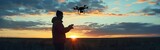 Young man controlling drone during serene sunset capturing essence of modern aerial technology and photography showcasing innovation in flight surveillance and videography with silhouette evening sky