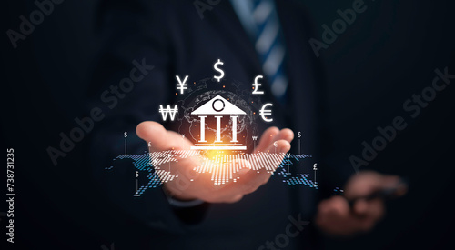 Businessman hold virtual central banking and international currency include dollar Yuan Yen Pound sterling and Euro for forex and currency exchange money transfer concept.Business finance. photo